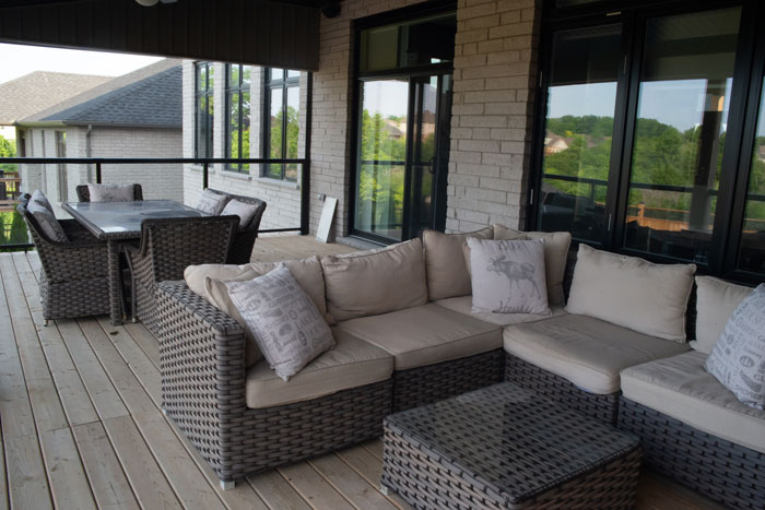 Royal Premier Homes - Eco Friendly Home Builders London - Cranbrook I - Balcony with Sofa and Tables